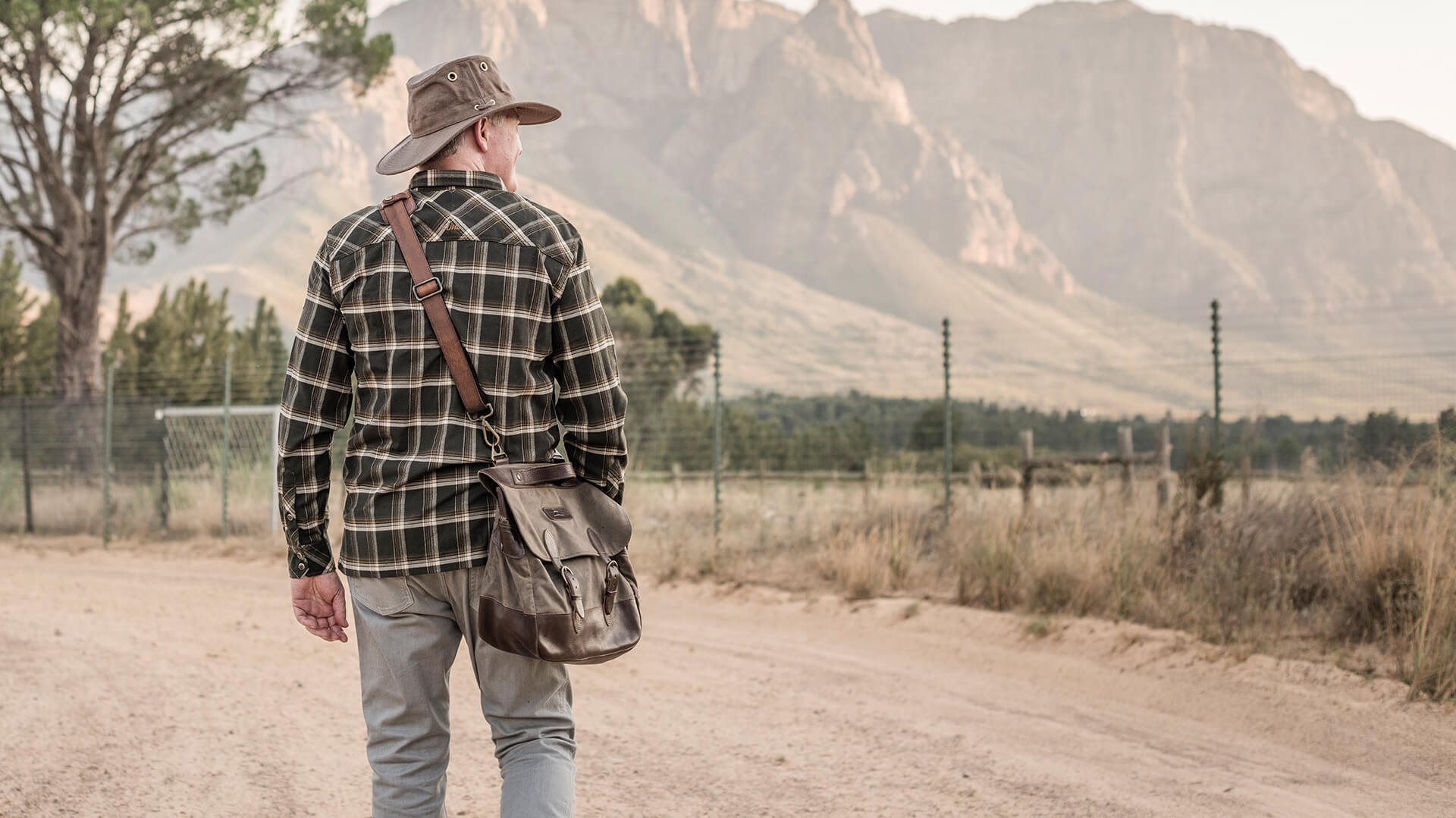 Man wearing Tilley hat in the wilderness